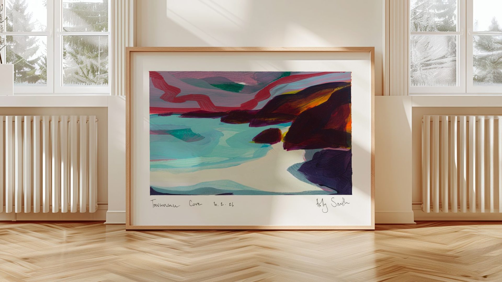 A framed abstract painting of Trevaunance Cove hanging on a light-coloured wall above a wooden herringbone floor.
